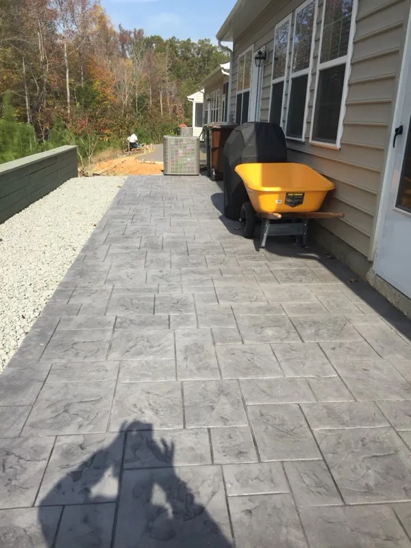 Gray stamped concrete patio installed in Charlotte, NC by Stamped Concrete Artisans